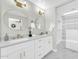 Bright bathroom with double vanity featuring gold fixtures and marble countertops offers a luxurious touch at 2926 N 16Th Ave, Phoenix, AZ 85015