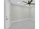 Bright bedroom with white marble floors, ceiling fan and white door at 2926 N 16Th Ave, Phoenix, AZ 85015