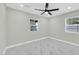 Bright bedroom with white marble floors, ceiling fan, two windows at 2926 N 16Th Ave, Phoenix, AZ 85015