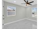 Bright bedroom featuring two windows, marble floors, and neutral colors, with great natural light at 2926 N 16Th Ave, Phoenix, AZ 85015