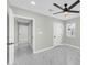 Bright bedroom with marble floors, a modern ceiling fan, and natural light through a window at 2926 N 16Th Ave, Phoenix, AZ 85015
