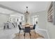 Contemporary dining area with round table, modern chandelier, and open concept design at 2926 N 16Th Ave, Phoenix, AZ 85015