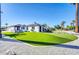 Inviting single-story home featuring manicured lawn, desert landscaping, and charming architectural details at 2926 N 16Th Ave, Phoenix, AZ 85015