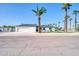 Spacious single-story home with a two car garage, desert landscaping, and palm tree lined street at 2926 N 16Th Ave, Phoenix, AZ 85015