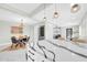 Open-concept kitchen and dining area with marble countertops, stainless steel appliances and sleek lighting at 2926 N 16Th Ave, Phoenix, AZ 85015