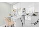 Modern kitchen boasts marble countertop island, stainless steel appliances, and elegant lighting fixtures at 2926 N 16Th Ave, Phoenix, AZ 85015