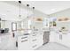 Stylish kitchen boasts marble countertops, stainless steel appliances, open layout, and modern lighting at 2926 N 16Th Ave, Phoenix, AZ 85015