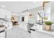 Well-lit kitchen features marble countertops, stainless steel appliances, white cabinets and sleek hardware at 2926 N 16Th Ave, Phoenix, AZ 85015