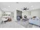 Open living room with a fireplace, ceiling fan, modern furniture, and marble tile flooring at 2926 N 16Th Ave, Phoenix, AZ 85015