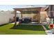 Relaxing backyard featuring a gazebo, artificial grass, and patio at 3017 E Bluefield Ave, Phoenix, AZ 85032