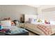 Inviting bedroom with patterned wallpaper, bright windows, and plush decor elements at 3017 E Bluefield Ave, Phoenix, AZ 85032