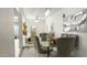 Bright dining room with a glass table, elegant chairs, and modern chandelier at 3017 E Bluefield Ave, Phoenix, AZ 85032