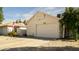 Charming home exterior featuring a well-maintained lawn and attached garage at 3017 E Bluefield Ave, Phoenix, AZ 85032