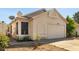 Charming home exterior featuring a well-maintained lawn and attached garage at 3017 E Bluefield Ave, Phoenix, AZ 85032