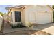 Charming home exterior featuring a well-maintained lawn and attached garage at 3017 E Bluefield Ave, Phoenix, AZ 85032