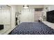 A stylish main bedroom is displayed with a vanity, full-length mirror and chandelier at 3017 E Bluefield Ave, Phoenix, AZ 85032