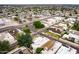 Scenic aerial view of residences with a mix of brown and white roofs, complemented by lush landscaping at 3029 W Sierra St, Phoenix, AZ 85029
