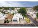 Home showcasing desert landscaping, attached garage, and mature trees from above at 3029 W Sierra St, Phoenix, AZ 85029