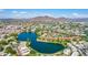 Expansive aerial view showcasing a lake, residential area, and distant mountains at 3029 W Sierra St, Phoenix, AZ 85029