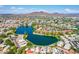 Scenic aerial shot featuring a tranquil lake, red tile roofs, and distant mountain views at 3029 W Sierra St, Phoenix, AZ 85029