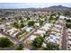 Panoramic aerial shot of a well-planned residential neighborhood with mountain views and community tennis courts at 3029 W Sierra St, Phoenix, AZ 85029