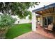 Backyard patio with tile and a green grass yard surrounded by a decorative block wall at 3029 W Sierra St, Phoenix, AZ 85029