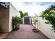 Backyard featuring storage shed and decorative rock landscaping surrounded by a block wall at 3029 W Sierra St, Phoenix, AZ 85029