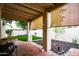 Covered patio with BBQ overlooking lush green grass and decorative rock landscaping at 3029 W Sierra St, Phoenix, AZ 85029