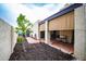 Exterior of home with covered patio overlooking desert landscaping and lush green grass at 3029 W Sierra St, Phoenix, AZ 85029
