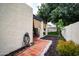 Exterior of home with hose and covered patio overlooking lush green grass and desert landscaping at 3029 W Sierra St, Phoenix, AZ 85029