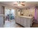 Cozy bedroom with sliding doors to patio, closet, and white wood furniture at 3029 W Sierra St, Phoenix, AZ 85029