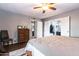Bedroom with dark wood floors, a grey ceiling fan, and a chest of drawers at 3029 W Sierra St, Phoenix, AZ 85029