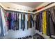 Organized walk-in closet featuring ample hanging space for shirts, jackets, and storage for hats and shoes at 3029 W Sierra St, Phoenix, AZ 85029