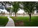 Scenic view of community lake with walking path and green space at 3029 W Sierra St, Phoenix, AZ 85029