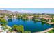 Aerial shot of lake featuring lakeside homes, and green trees at 3029 W Sierra St, Phoenix, AZ 85029