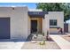 Charming single-story home with desert landscaping, a private front courtyard, and a gray two-car garage at 3029 W Sierra St, Phoenix, AZ 85029