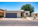 Charming single-story home with desert landscaping, private front courtyard, and a gray two-car garage at 3029 W Sierra St, Phoenix, AZ 85029