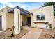 Inviting front porch with a tiled walkway and a shaded entryway at 3029 W Sierra St, Phoenix, AZ 85029
