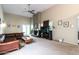 Bright living room with a cozy fireplace, high ceilings, and a ceiling fan at 3029 W Sierra St, Phoenix, AZ 85029