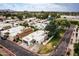 Aerial view showcases the house, the road and surrounding residential neighborhood at 3029 W Sierra St, Phoenix, AZ 85029