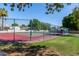 Outdoor tennis courts with green and red surfaces, surrounded by fencing at 3029 W Sierra St, Phoenix, AZ 85029