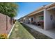 Backyard featuring a covered patio area and well-maintained landscaping at 3117 S Signal Butte Rd # 484, Mesa, AZ 85212