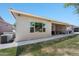 View of the home's exterior highlighting the covered patio, backyard, and desert landscaping at 3117 S Signal Butte Rd # 484, Mesa, AZ 85212