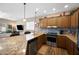 Modern kitchen with stainless steel appliances, granite countertops, and an open layout to the living room at 3117 S Signal Butte Rd # 484, Mesa, AZ 85212