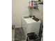 Modern laundry room with shelving and gray rug at 36354 W San Clemente Ave, Maricopa, AZ 85138