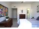 Comfortable bedroom with cool gray floors and walls, complete with modern furniture at 3650 E Montecito Ave # 4, Phoenix, AZ 85018
