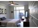 Bright bedroom featuring a sliding glass door to the patio, relaxing decor, and natural light at 3650 E Montecito Ave # 4, Phoenix, AZ 85018
