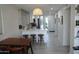 Open-concept kitchen with breakfast bar, dining area, and modern finishes at 3650 E Montecito Ave # 4, Phoenix, AZ 85018