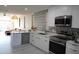 Modern kitchen featuring white cabinets and stainless steel appliances at 3650 E Montecito Ave # 4, Phoenix, AZ 85018
