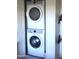 Efficient laundry area featuring a stacked washer and dryer for space saving at 3650 E Montecito Ave # 4, Phoenix, AZ 85018